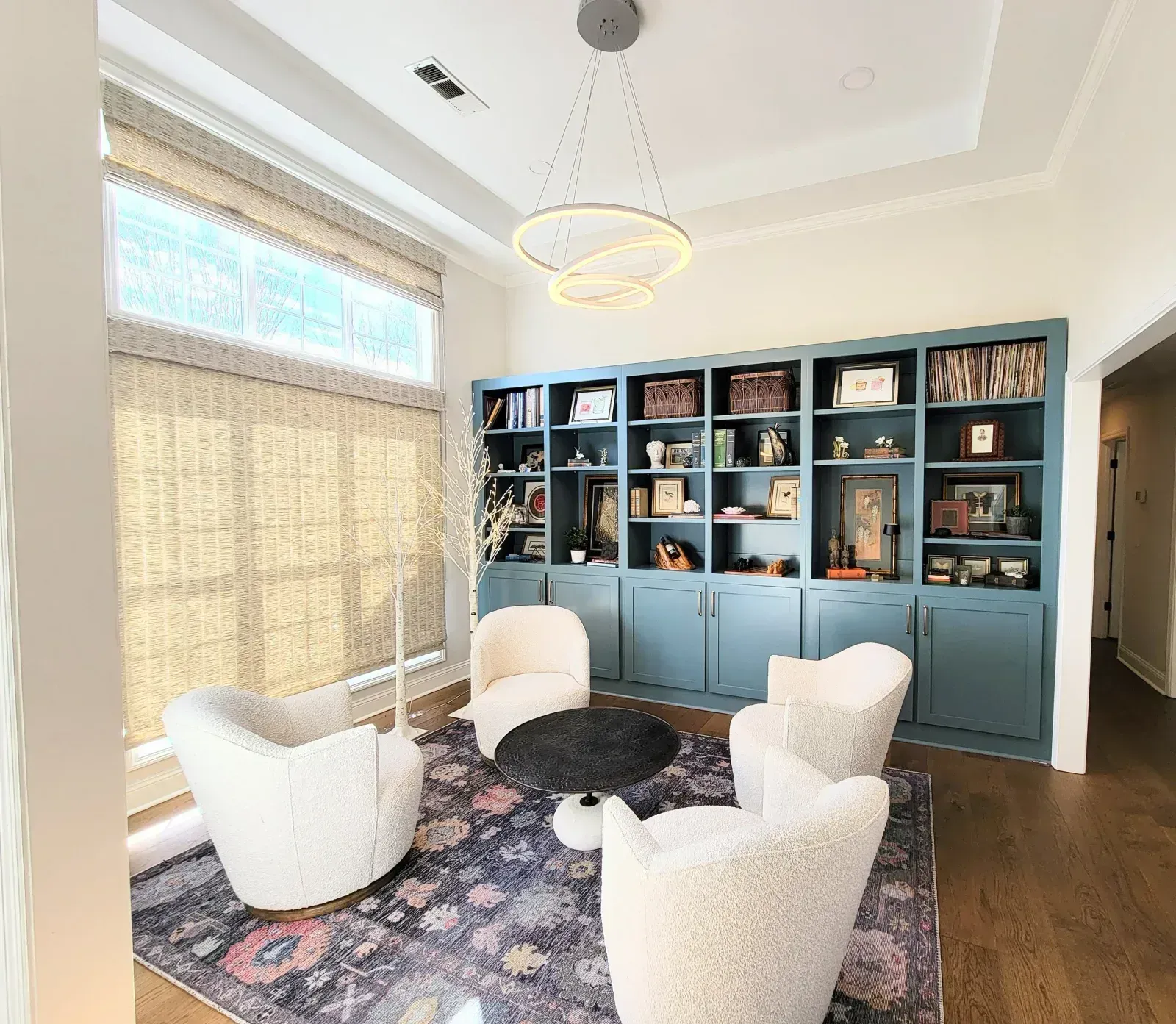 Custom built-in bookcase painted blue in an Auburn AL home