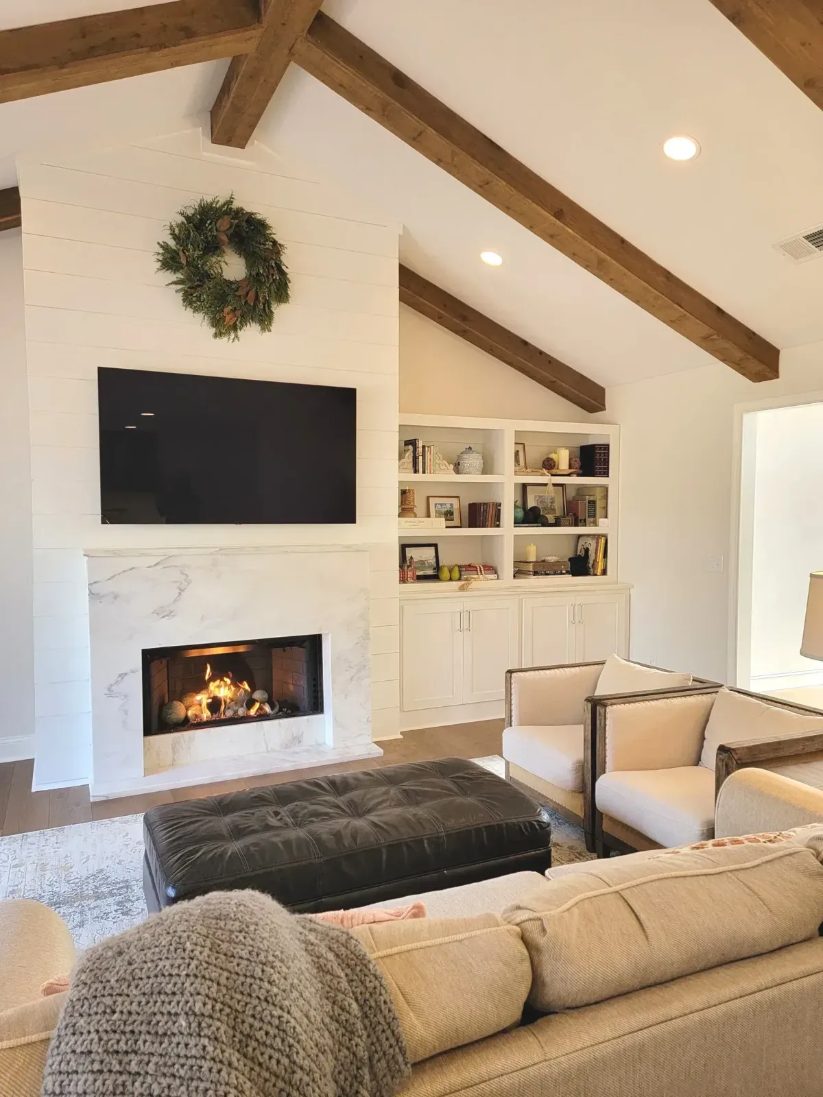 Built-in shelves beside a fireplace