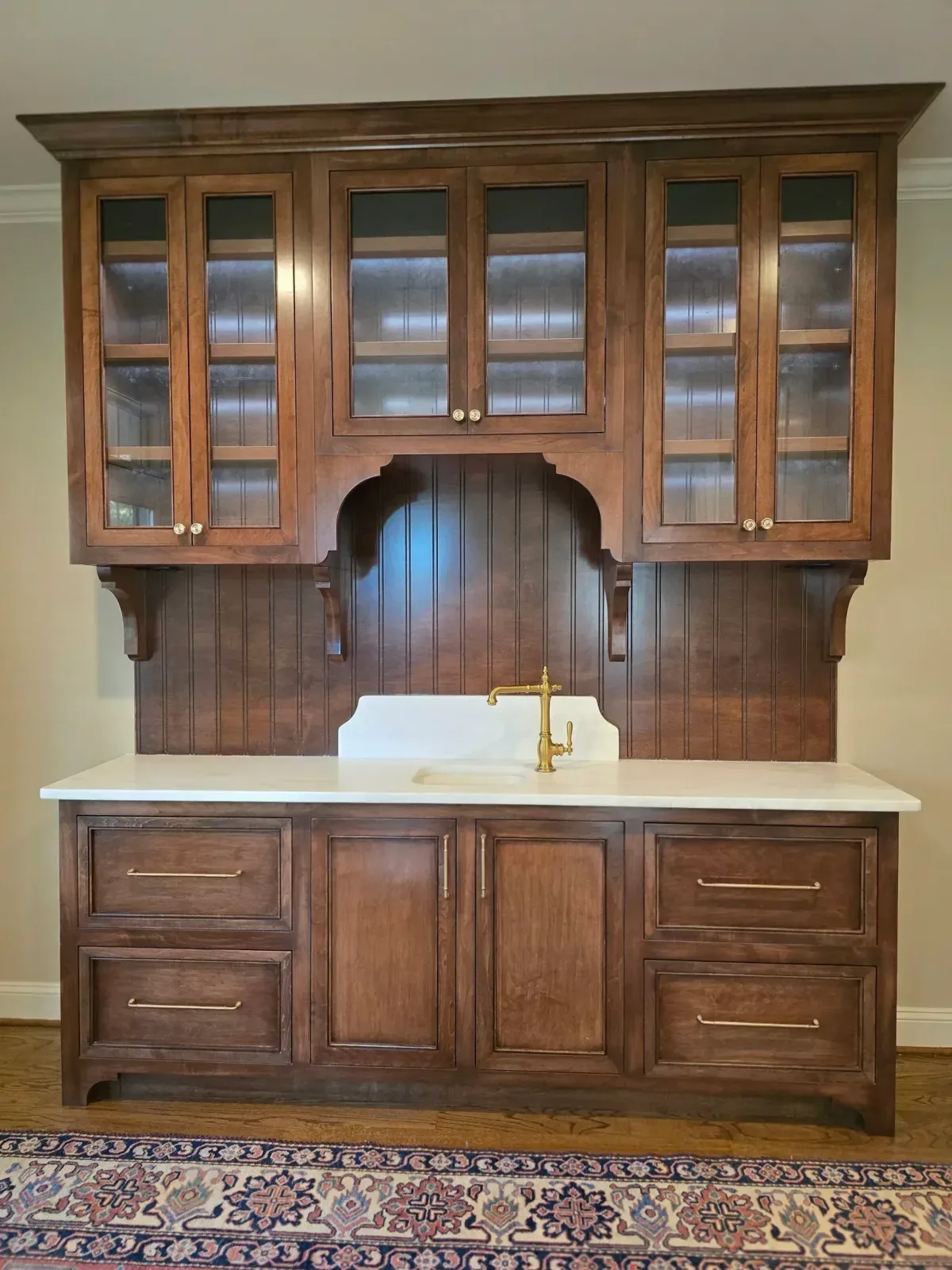 Walnut built-in hutch with glass doors