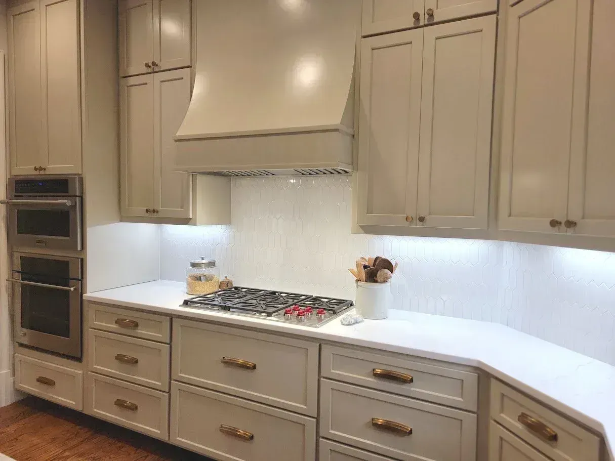 Painted custom kitchen cabinets with a range hood built in Auburn AL